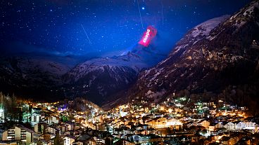 The Matterhorn mountain is illuminated by light artist Gerry Hofstetter aiming to send messages of hope and support to the ones suffering from COVID-19. Zermatt, Switzerland