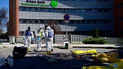 Members of the Military Emergencies Unit (UME) prepare to carry out a general disinfection at the Arturo Soria residence for the elderly in Madrid on March 28, 2020