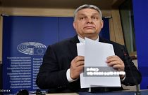 Hungarian Prime Minister Viktor Orban, second right, welcomes the staff of the Chinese Suparna Airlines at Liszt Ferenc International Airport in Budapest, Hungary