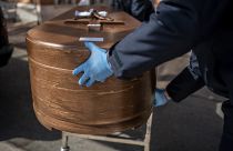The coffin containing remains of a victim of the COVID-19 is taken for cremation at the Almudena cemetery in Madrid, Spain, Saturday March 28, 2020.
