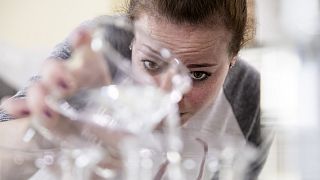 Caitlin Bagenstose makes hand sanitizer at the Eight Oaks Farm Distillery in New Tripoli, Pa., Monday, March 16, 2020