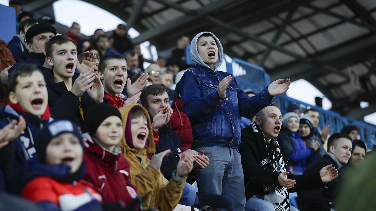 In this photo taken on Friday, March 27, 2020, young fans react during the Belarus Championship soccer match between Torpedo-BelAZ Zhodino and Belshina Bobruisk.