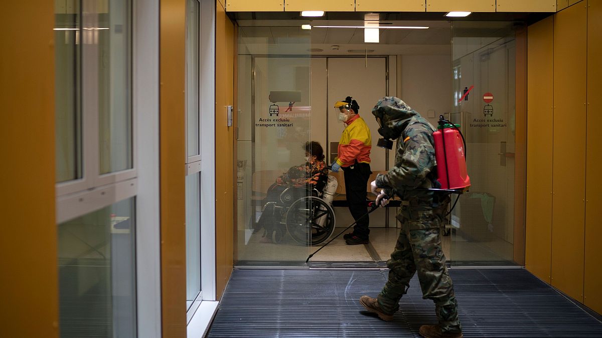 An entrance to a hospital in Barcelona is disinfected