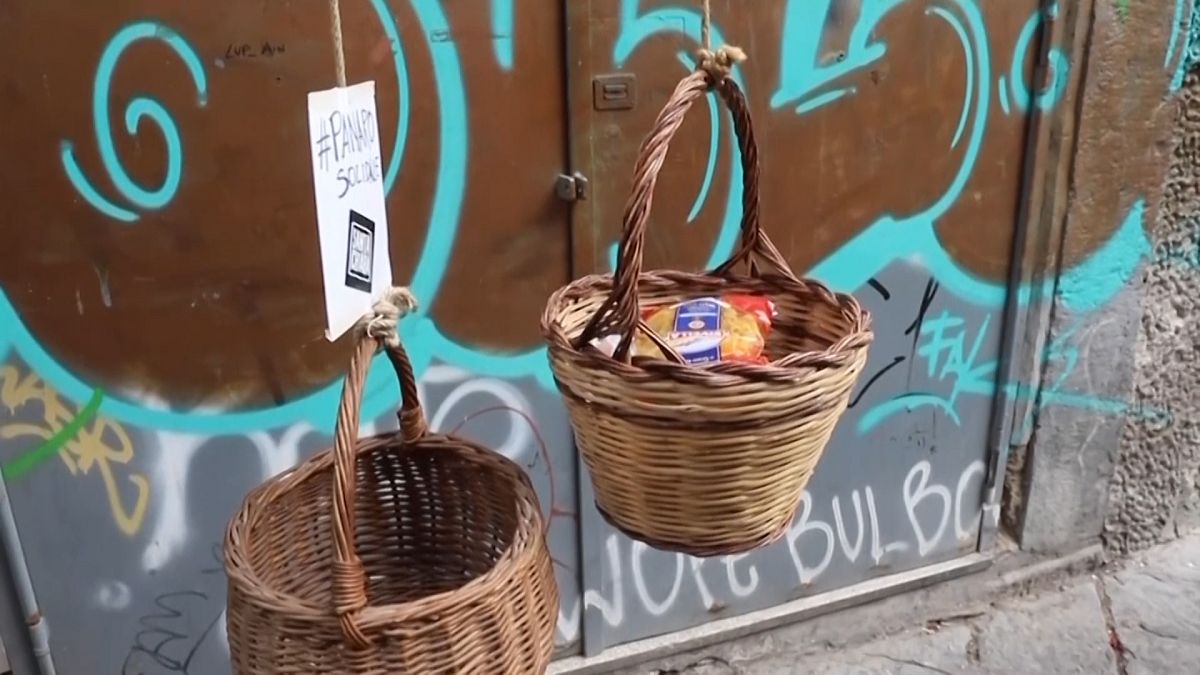 Baskets of solidarity lowered from Naples balconies amid coronavirus chaos