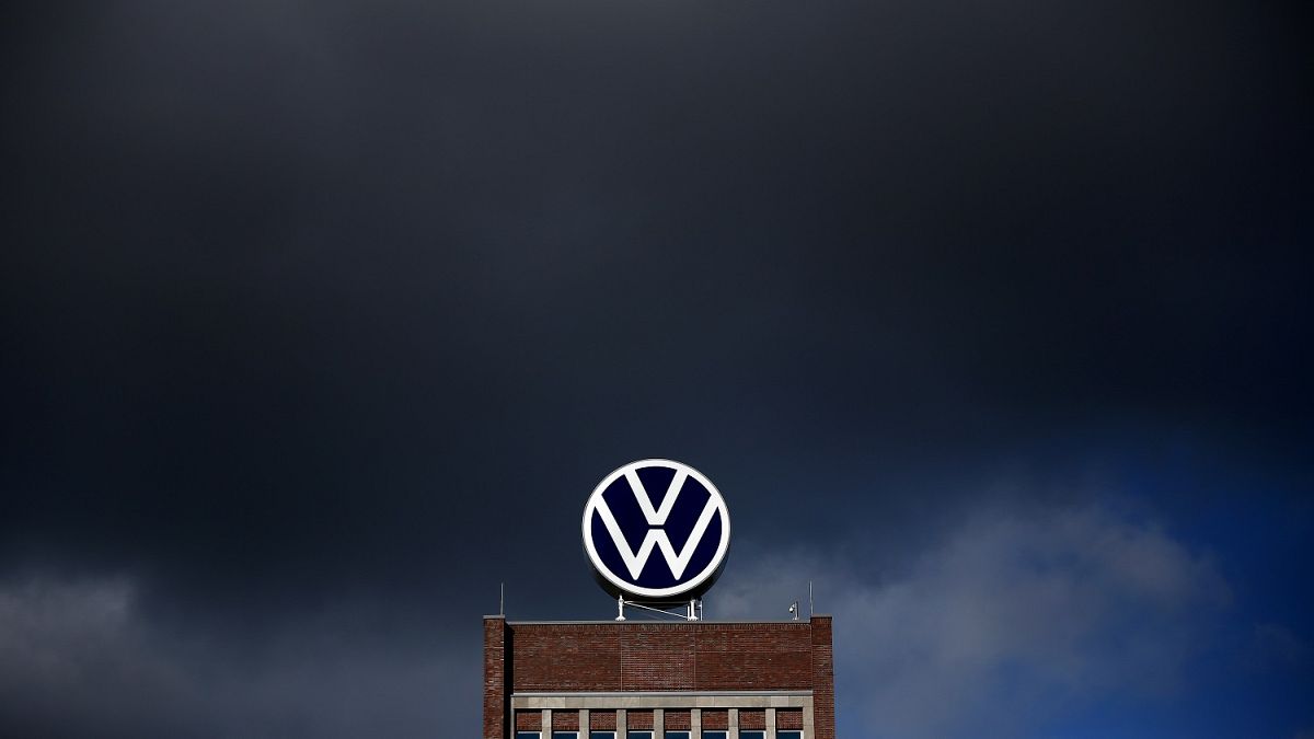 Dark clouds hang over the company headquarters of German car maker Volkswagen (VW) in Wolfsburg on February 28, 2020