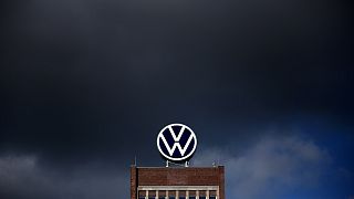 Dark clouds hang over the company headquarters of German car maker Volkswagen (VW) in Wolfsburg on February 28, 2020