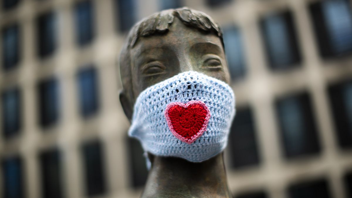A statue wears a knitted face mask during a partial lockdown against the spread of the Covid-19 coronavirus in Brussels, Belgium