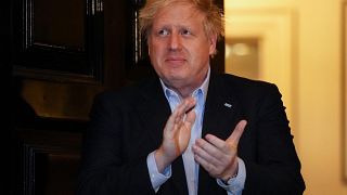 UK Prime Minister Boris Johnson participates in a national "clap for carers" to show thanks for health workers and medical staff during the coronavirus pandemic, April 2, 2020