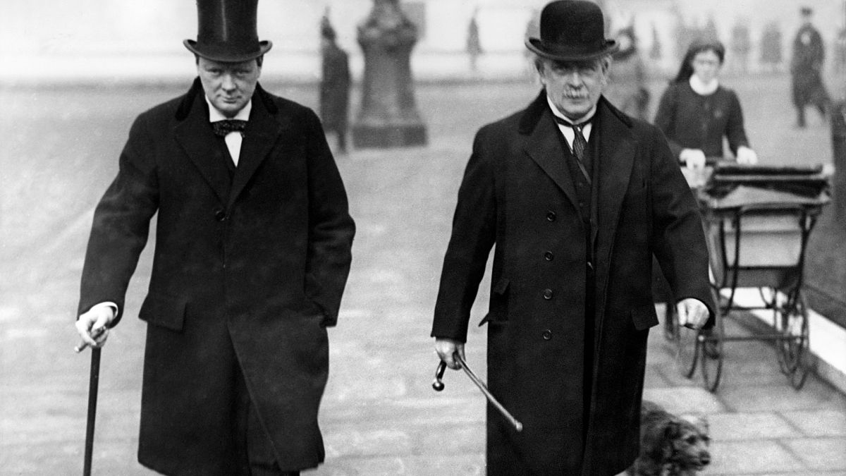 British leader of the Liberal Party David Lloyd George (R), walking next to leader of the Conservative Party Winston Churchill, in London in 1934.