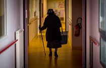 A resident walks down a corridor in Housing Establishment for Dependant Elderly People in Brest, western France