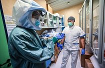 A nurse puts on his Personal Protective Equipment (PPE) at the Policlinico di Tor Vergata hospital, in Rome on April 8, 2020.