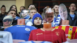 Mannequins in soccer uniforms with the faces of "virtual fans" who bought tickets online are seen on grandstand seats during the match between FC Dynamo Brest and FC Shakhter 