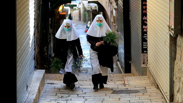 Nuns walk along the Via Dolorosa Nuns walk along the Via Dolorosa