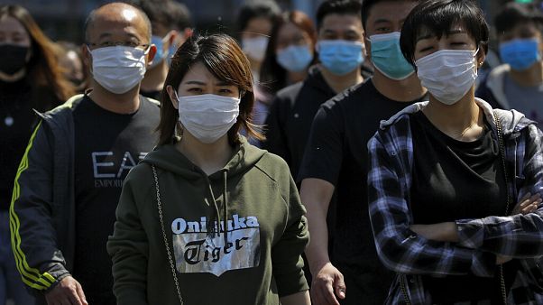 Maszkot viselnek Peking utcáin Maszkot viselnek Peking utcáin