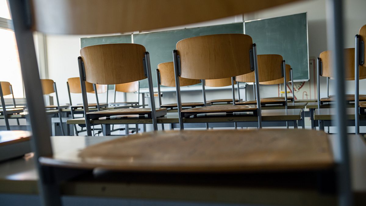 (FILES) This file photo taken on March 13, 2020 shows an empty classroom at a high school in Halle/Saale. (Photo by JENS SCHLUETER / AFP)