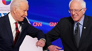 (US vice president Joe Biden (L) and Senator Bernie Sanders greet each other with a s