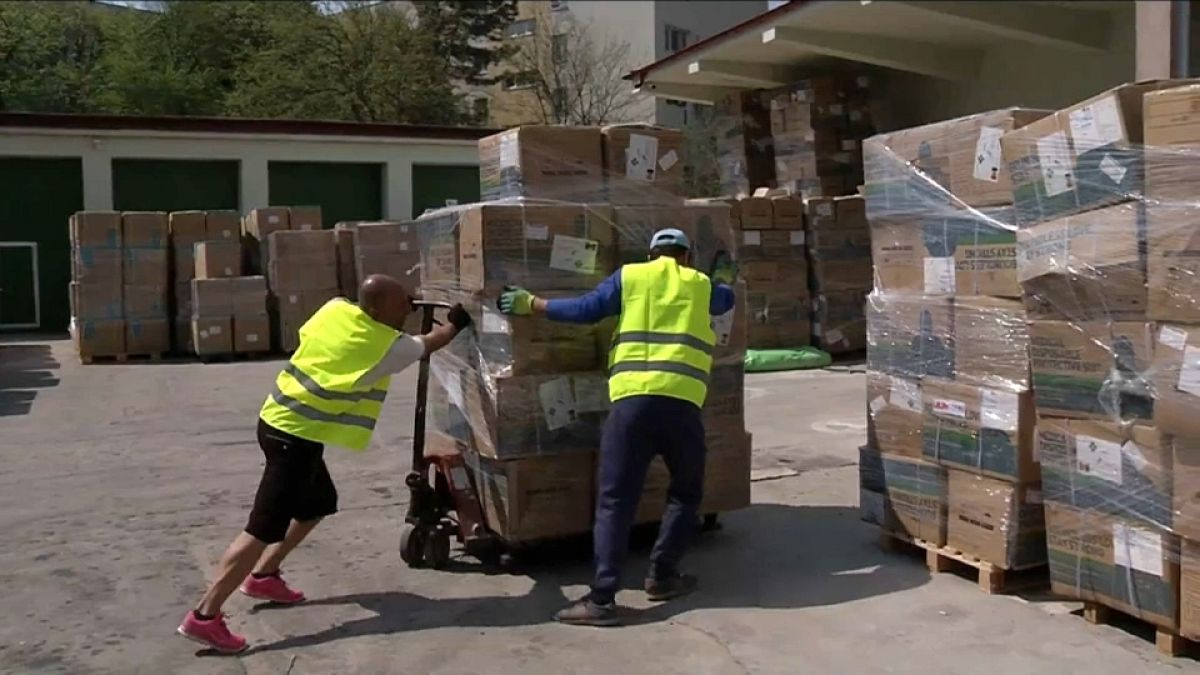 Workers unloading medical equipment at Romania's Covid Command centre