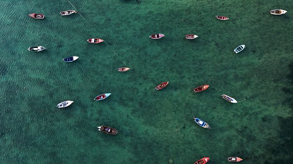 An aerial view shows fisher boats at the harbour in Sal Rei at Boa Vista island, Cape Verde, on January 06, 2020. (Photo by INA FASSBENDER / AFP) An aerial view shows fisher boats at the harbour in Sal Rei at Boa Vista island, Cape Verde, on January 06, 2020. (Photo by INA FASSBENDER / AFP)