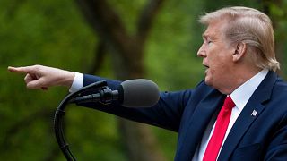 President Donald Trump points to a question as he speaks about the coronavirus in the Rose Garden of the White House, Tuesday, April 14, 2020, in Washington.