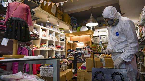 A children's clothing store is sanitised ahead of re-opening in Italy A children's clothing store is sanitised ahead of re-opening in Italy