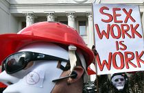 Sex workers wearing masks demonstrate in Ukraine for rights