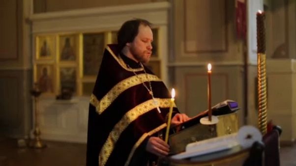 Orthodox priest conducting church service in Moscow for online worshippers Orthodox priest conducting church service in Moscow for online worshippers
