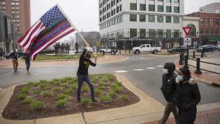 A man approaches the Capitol Building during Operation Gridlock, a protest against aspects of Gov. Whitmer's lockdown order, in Lansing, Michigan, Wednesday, April 15, 2020.