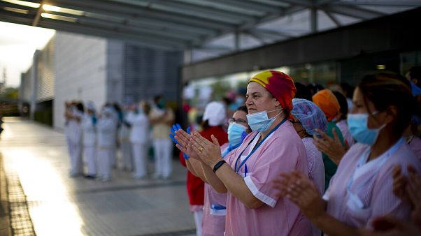 Health workers applaud medical staff working at the Puerta de Hierro hospital in Majadahonda, Spain, Saturday, April 18, 2020 Health workers applaud medical staff working at the Puerta de Hierro hospital in Majadahonda, Spain, Saturday, April 18, 2020