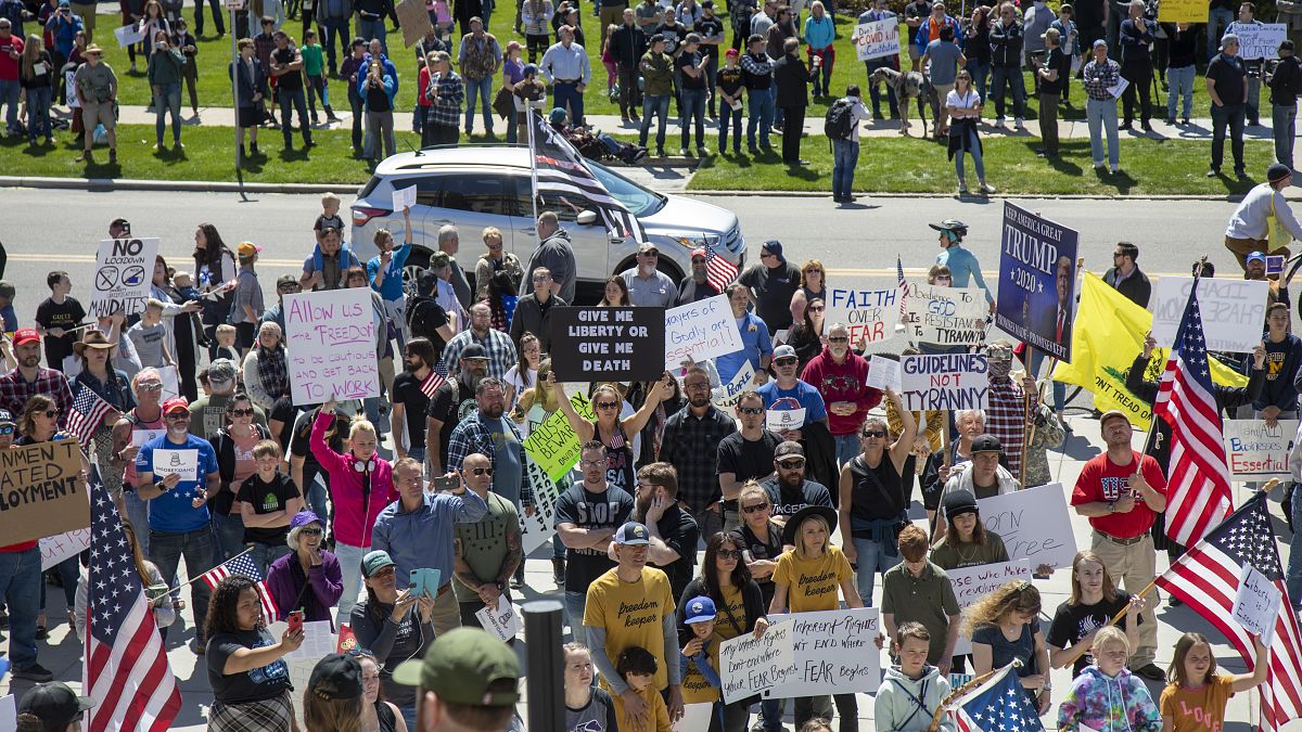 Several hundred people attend a "Stand for Freedom" rally against - and in violation of - a stay-at-home locidown order in Boise, Idaho, Friday, April 17, 2020. 