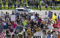 Several hundred people attend a "Stand for Freedom" rally against - and in violation of - a stay-at-home locidown order in Boise, Idaho, Friday, April 17, 2020.
