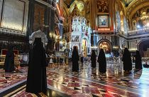 Russian Orthodox Church nuns, observe social distancing guidelines as they attend an Orthodox Easter service at Moscow's Christ the Saviour Cathedral, Sunday, April 19, 2020