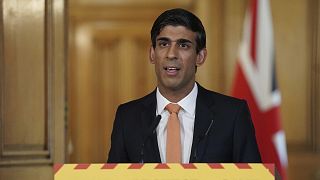 In this handout photo provided by 10 Downing Street, Britain's Chancellor Rishi Sunak speaks during a media briefing on the coronavirus outbreak in Downing Street, London