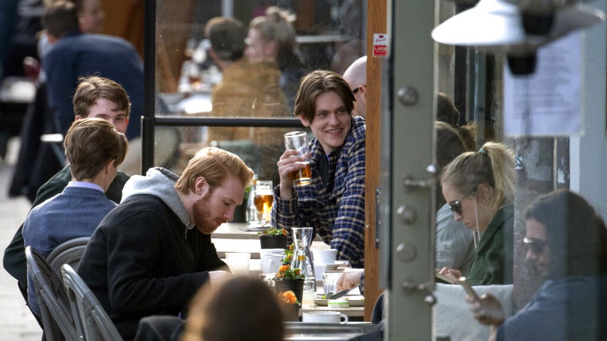People enjoy themselves at an outdoor restaurant, amid the coronavirus outbreak, in central Stockholm, Sweden