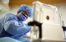 A doctor performs surgery in Canada in April 2020.