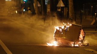 A car  burns in the street during clashes in Villeneuve-la-Garenne, in the northern suburbs of Paris, early on April 21, 2020