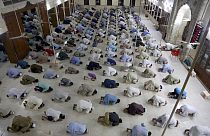 People attend evening prayers while maintaining social distancing to help avoid the spread of the coronavirus, at a mosque in Karachi, Pakistan, Sunday, April 19, 2020