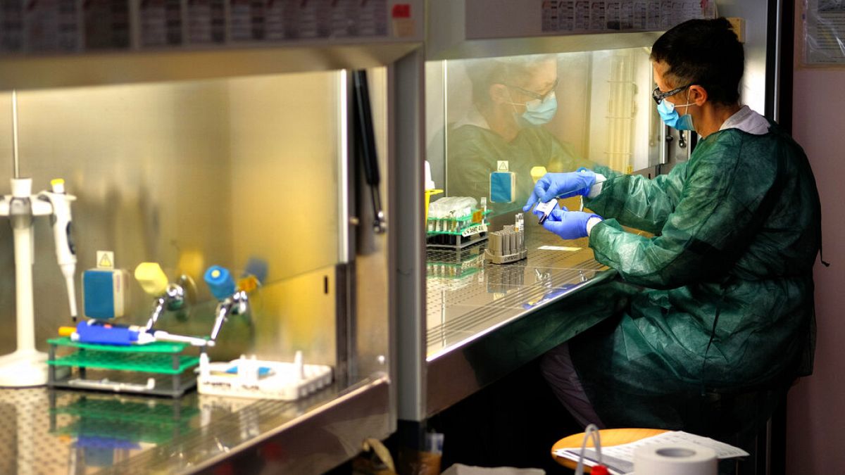 A technician works in the lab of the COVID-19 department of the Policlinic of Tor Vergata in Rome, Friday, April 17, 2020.