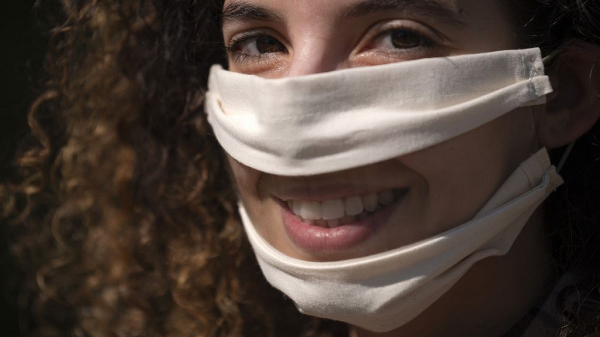 French Anissa Mekrabech, wearing the protective face mask she created for the deaf earing-impaired people