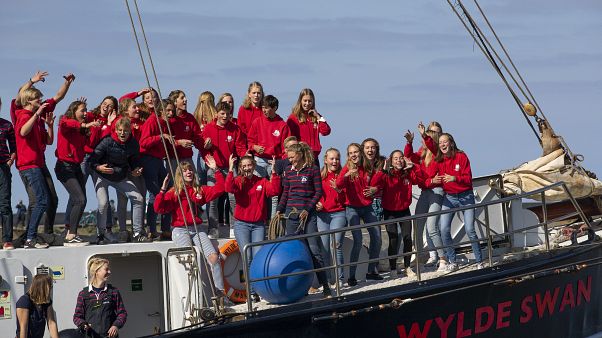 Dutch teens cheer after arriving home in Harlingen on April 26 following a trans-Atlantic forced on them by lockdown restrictions. Dutch teens cheer after arriving home in Harlingen on April 26 following a trans-Atlantic forced on them by lockdown restrictions.