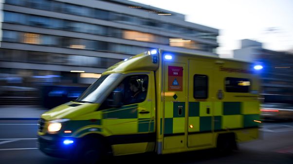 An ambulance drives past St Thomas' Hospital in central London on April 7, 2020. An ambulance drives past St Thomas' Hospital in central London on April 7, 2020.
