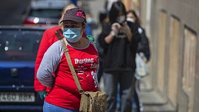 People line up to buy supplies from a supermarket as the lockdown to combat the spread of coronavirus in Madrid, Spain