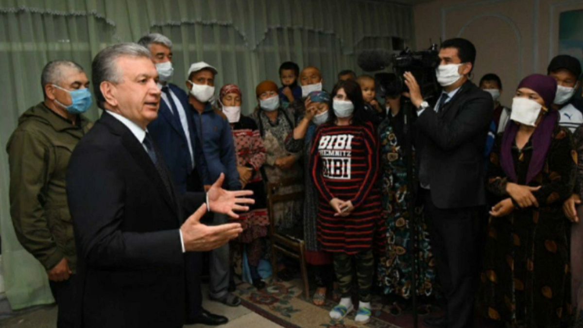 Uzbekistan's President Shavkat Mirziyoev meets with evacuees on May 2, 2020.