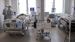 Doctors attend to a patient inside the intensive care unit for people infected with the new coronavirus, at a hospital in Moscow, Russia, May 2, 2020.