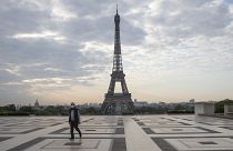 A man wears a mask to protect against the spread of the coronavirus as he walks along the Trocadero square close to the Eiffel Tower in Paris