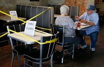 Tables are taped off to promote social distancing at Falcone's Pizzeria in Oklahoma City, as restaurants are allowed to open for in person dining