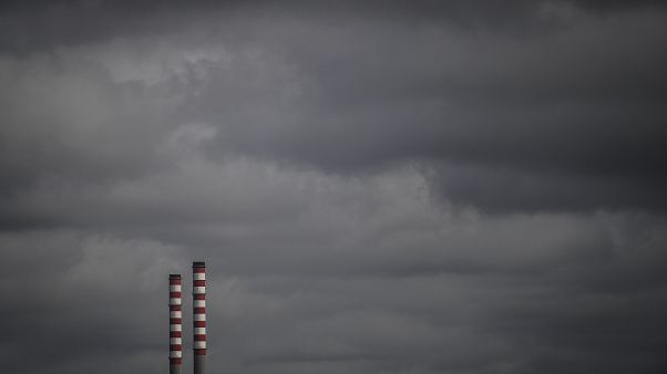 Industrial chimneys are pictured at Sines port on February 12, 2020 in Sines. (Photo by PATRICIA DE MELO MOREIRA / AFP) Industrial chimneys are pictured at Sines port on February 12, 2020 in Sines. (Photo by PATRICIA DE MELO MOREIRA / AFP)
