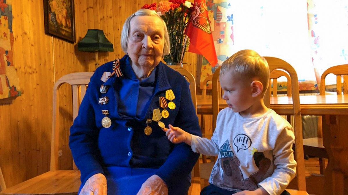 Zinaida Korneva, World War II veteran with her great-great grandchild Richard Panov in St. Petersburg, Russia, Tuesday, May 5, 2020.