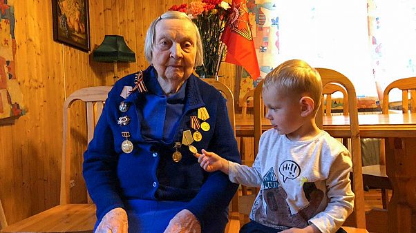 Zinaida Korneva, World War II veteran with her great-great grandchild Richard Panov in St. Petersburg, Russia, Tuesday, May 5, 2020. Zinaida Korneva, World War II veteran with her great-great grandchild Richard Panov in St. Petersburg, Russia, Tuesday, May 5, 2020.