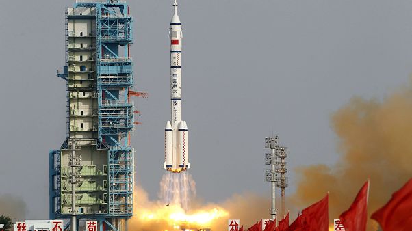 FILE: In this file photo taken Saturday, June 16, 2012, a Shenzhou 9 spacecraft Long March rocket with 3 astronauts including China's first female astronaut launches FILE: In this file photo taken Saturday, June 16, 2012, a Shenzhou 9 spacecraft Long March rocket with 3 astronauts including China's first female astronaut launches
