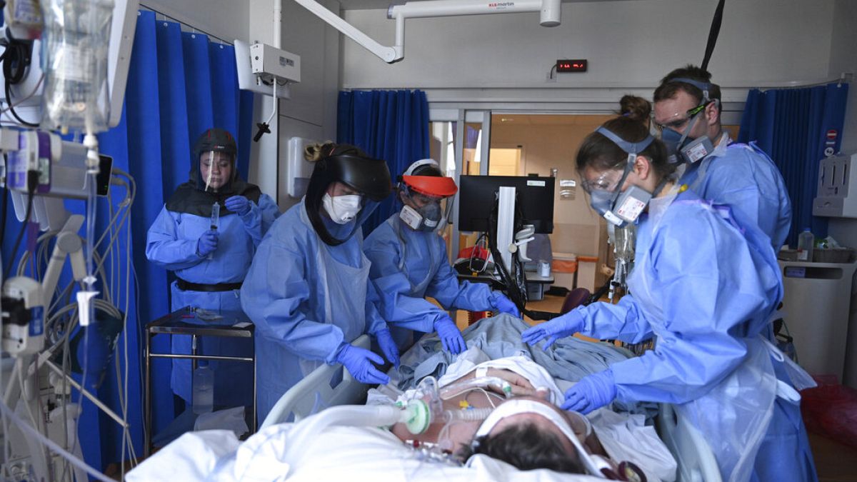 Members of clinical staff care for a patient with coronavirus in the intensive care unit at the Royal Papworth Hospital in Cambridge, UK, Tuesday May 5, 2020